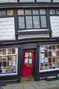 The red door and the crooked windows of a home in canterbury