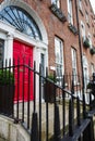 A red door in Dublin, Ireland. Arched Georgian door house front Royalty Free Stock Photo