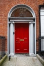 A red door in Dublin, Ireland. Arched Georgian door house front Royalty Free Stock Photo