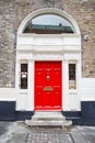 A red door in Dublin, Ireland. Arched Georgian door house front Royalty Free Stock Photo
