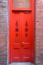 Red door in Fan Tan Alley in Chinatown in Victoria, British Columbia, Canada.