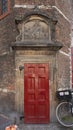 Red Door and Gable Stone for S. Lucas Gild, Waag House, Amsterdam, The Netherlands Royalty Free Stock Photo