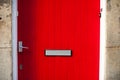Red door with a letter slot Royalty Free Stock Photo