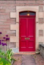 Red door in old house in Scotland Royalty Free Stock Photo