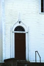 Red door of an 1823 still standing in 2023 Church