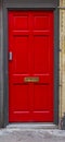 A red door in the streets of London in Summer