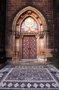 A red door to an old church