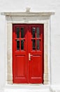 Red door, typical of a house on the island of Myconos, Cyclades, Greece Royalty Free Stock Photo