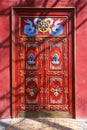 Red door in Vajradhara Temple, part of the Gandantegchinlen Monastery  Gandan , Ulaanbaatar or Ulan-Bator, Mongolia Royalty Free Stock Photo