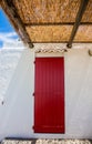 Red door on the white wall Royalty Free Stock Photo