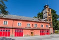 Red doors of the historic fire station in Volary