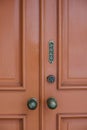Old Red Door with Pull Sign and Old Door Knobs Royalty Free Stock Photo