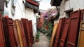 Red doors on the side walk to the village in Lijiang Old town ,Yunnan, China Royalty Free Stock Photo