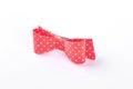 Red dotted bow tie over white. Royalty Free Stock Photo