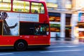 Red double decker bus in motion blur in London night traffic Royalty Free Stock Photo