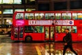 Red double decker bus in motion blur in London night traffic Royalty Free Stock Photo