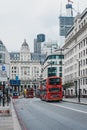 Red double decker buses on King William Street in the City of London, London, UK. Royalty Free Stock Photo