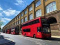 Red double-decker buses at King`s Cross station, London Royalty Free Stock Photo
