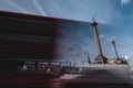 Red Double Decker busses passing the Trafalgar Square in front of the Nelson column Royalty Free Stock Photo