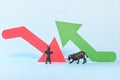 Red downward arrow and green upward arrow beside a bear and bull animal figure. Bearish versus Bullish market clash in stocks and