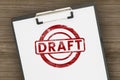 Red Draft rubber stamp on white paper clipboard Royalty Free Stock Photo