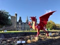 Red dragon in front of the Cardiff Castle and Victorian Gothic revival mansion in Cardiff, Wales.