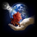 Red dragon on a hand on a background of the earth Royalty Free Stock Photo