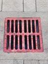 Red drain manhole Royalty Free Stock Photo
