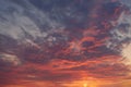 Red dramatic sunset sky with black rainy clouds. Soft focus Royalty Free Stock Photo