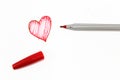 The red drawing of heart sign with pen on white background Royalty Free Stock Photo