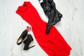 Red dress with, black shoes and leather jacket. Fashionable concept. Royalty Free Stock Photo