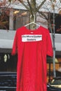 A red dress with text `No more stolen sisters` is hanging on the tree near The Law Courts .