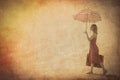 Red dress with umbrella and suitcase on the beach Royalty Free Stock Photo