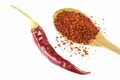 Red dried crushed hot chili peppers and chili flakes or powder isolated on white background Royalty Free Stock Photo