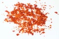 Red dried crushed hot chili peppers and chili flakes or powder isolated on white background, healthy turkish spice Royalty Free Stock Photo