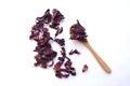 Red dried hibiscus flower leaves in a little wooden spoon, floral tea healthy drink Royalty Free Stock Photo