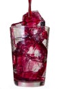 Red drink in a glass with ice cubes Royalty Free Stock Photo