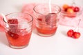 Red drink with ice, mint leaves and strawberry. Cocktail making bar tools Royalty Free Stock Photo