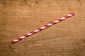 Red drinking straw on wood background Royalty Free Stock Photo