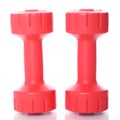 Red dumbells over white background Royalty Free Stock Photo