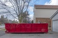 Red Dumpster Bin on the Driveway of a Suburban House #2