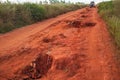 Red dust and mud road in poor condition with large holes and bumps formed after rain. Routes to Andringitra national park are Royalty Free Stock Photo