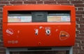 Red dutch mailbox on a wall in Leiden, Netherlands