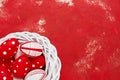 Red Easter background. Red and white Easter eggs in wreath on red background. Top view, copy space Royalty Free Stock Photo