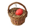Red Easter egg in the basket Royalty Free Stock Photo