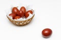 a red easter egg lies on the background of a basket with eggs Royalty Free Stock Photo