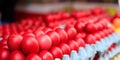 Red easter eggs for sale at an open-air market Royalty Free Stock Photo