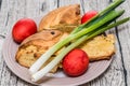Red Easter Eggs with spring onion and sweet Istrian easter bread Royalty Free Stock Photo