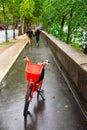 Red electric bicycle on side walk Royalty Free Stock Photo