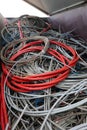 Red electric cable for very high voltage and also many electric cables used in the recyclable material landfill Royalty Free Stock Photo